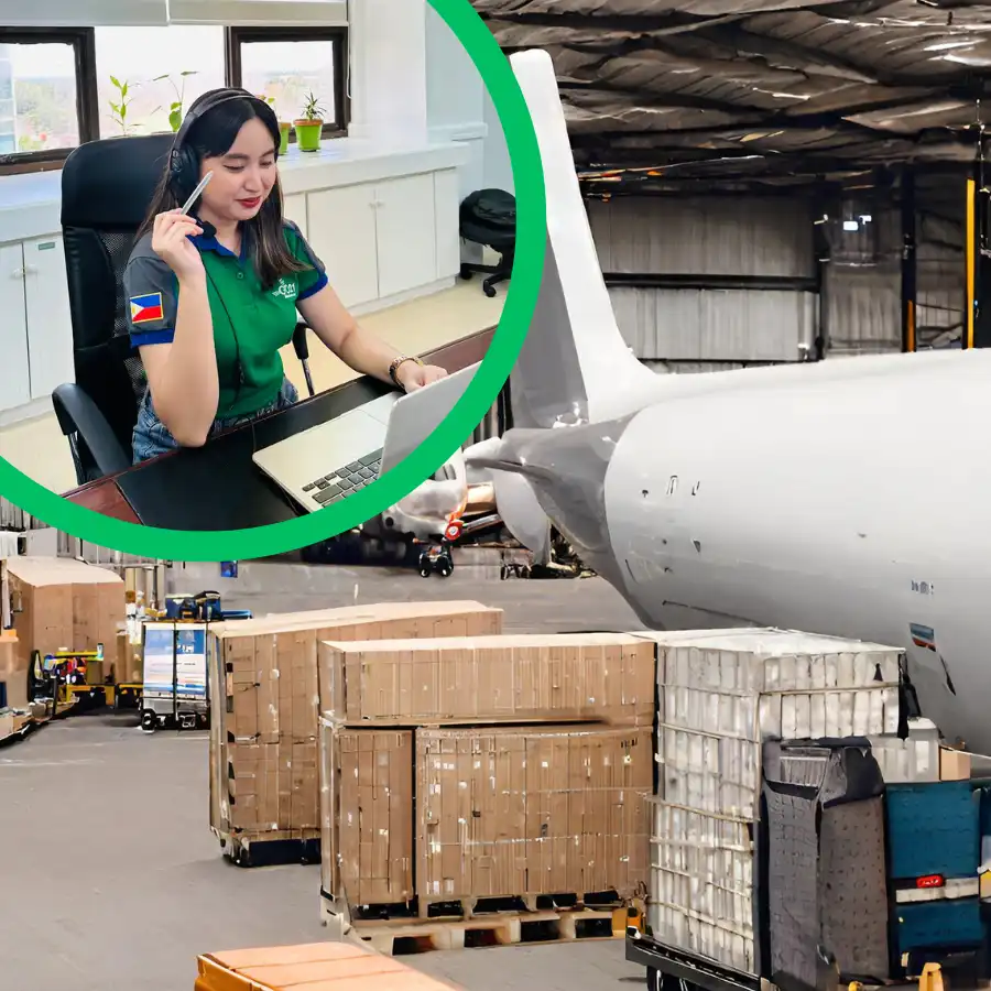 A GO21 employee using a laptop and headphones against a background of cargo next to a plane
