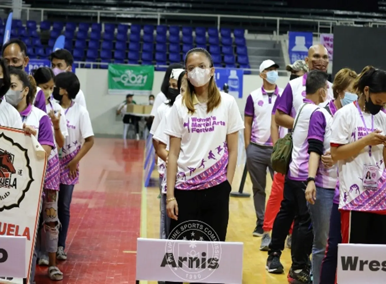 Women's Martial Arts Festival participants lined up according to their sport
