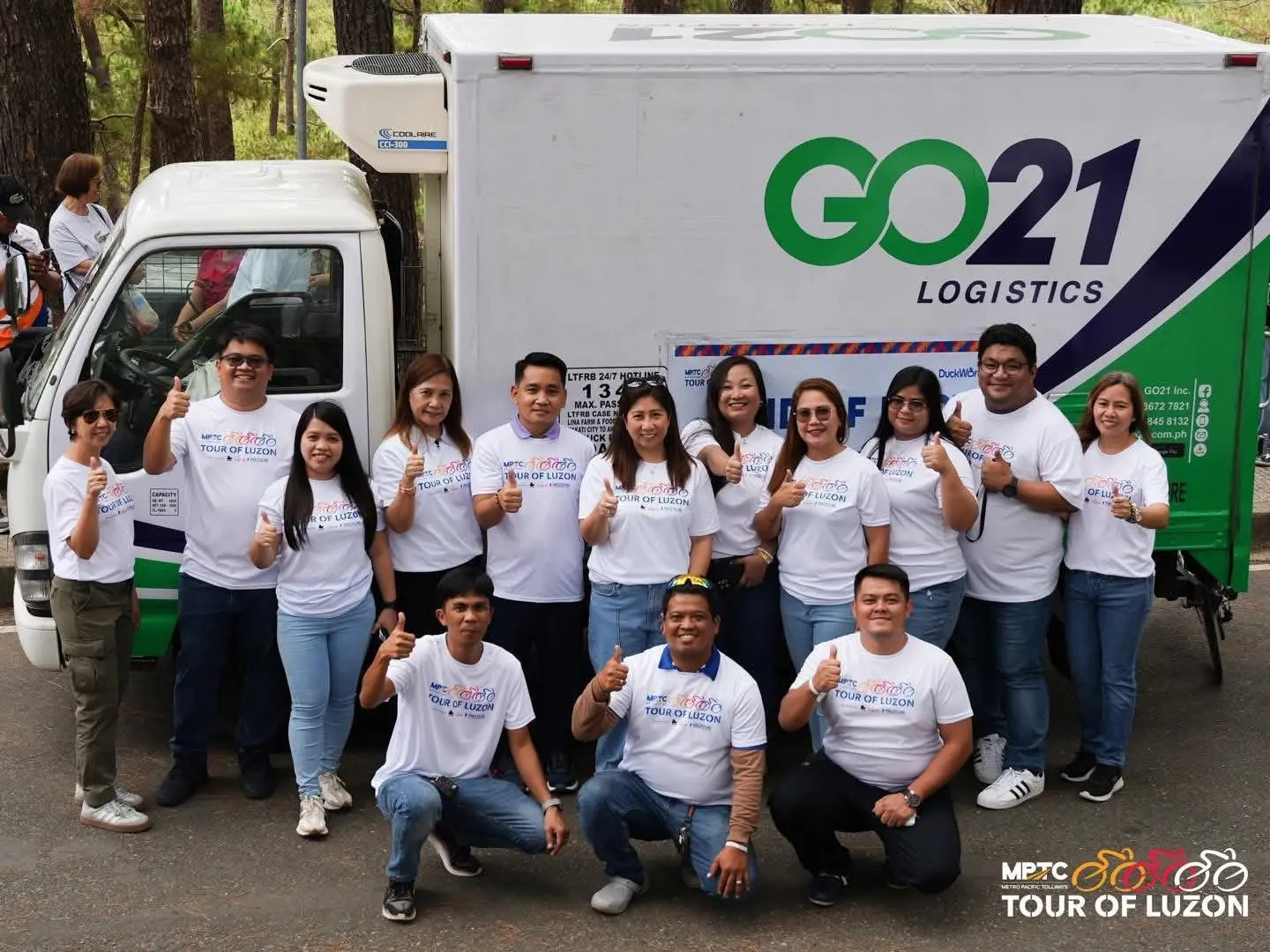 GO21 employees in front of a truck with the GO21 logo