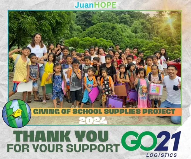 GO21 employees with schoolchildren holding school supplies